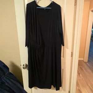 Beautiful black polyester dress with dramatic hem longer on one side!